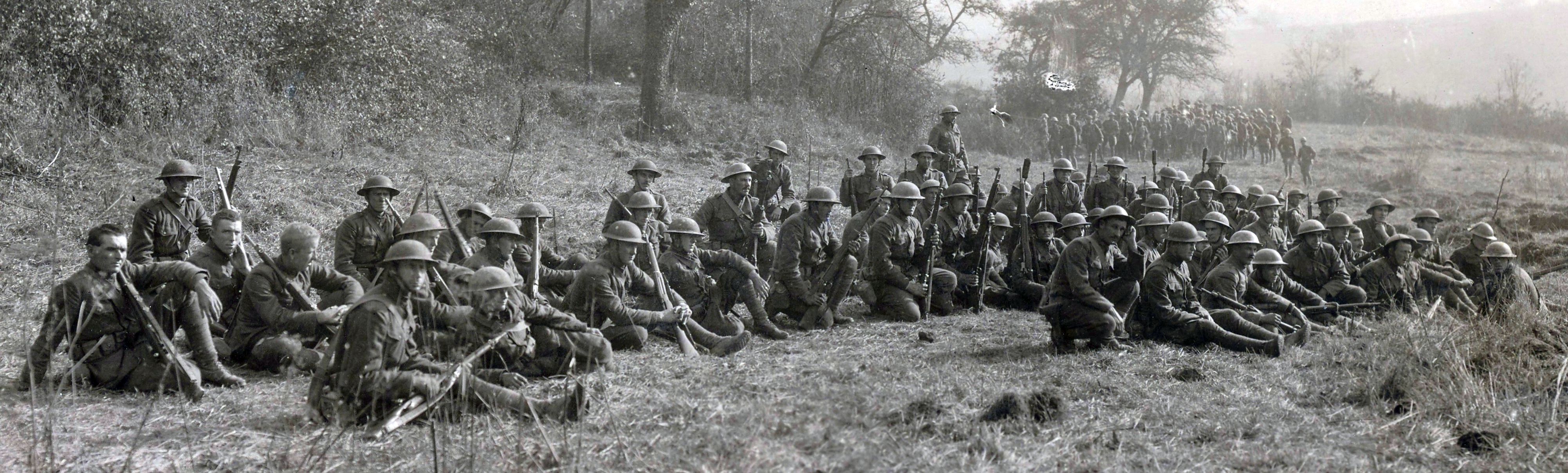 Survivors of the Lost Battalion's ordeal rest after being rescued. National Archives.