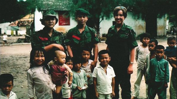 Army Nurse Corps Lt. Diane Carlson poses with South Vietnamese service members