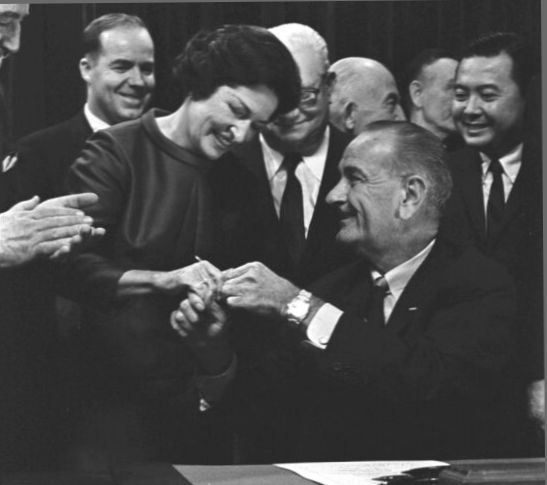 LBJ handed Lady Bird a pen he used to sign the High Beautification Act in 1965